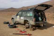 Car wheel change in desert