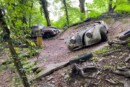 this junkyard set up in the woods is loaded with rare classic cars 1