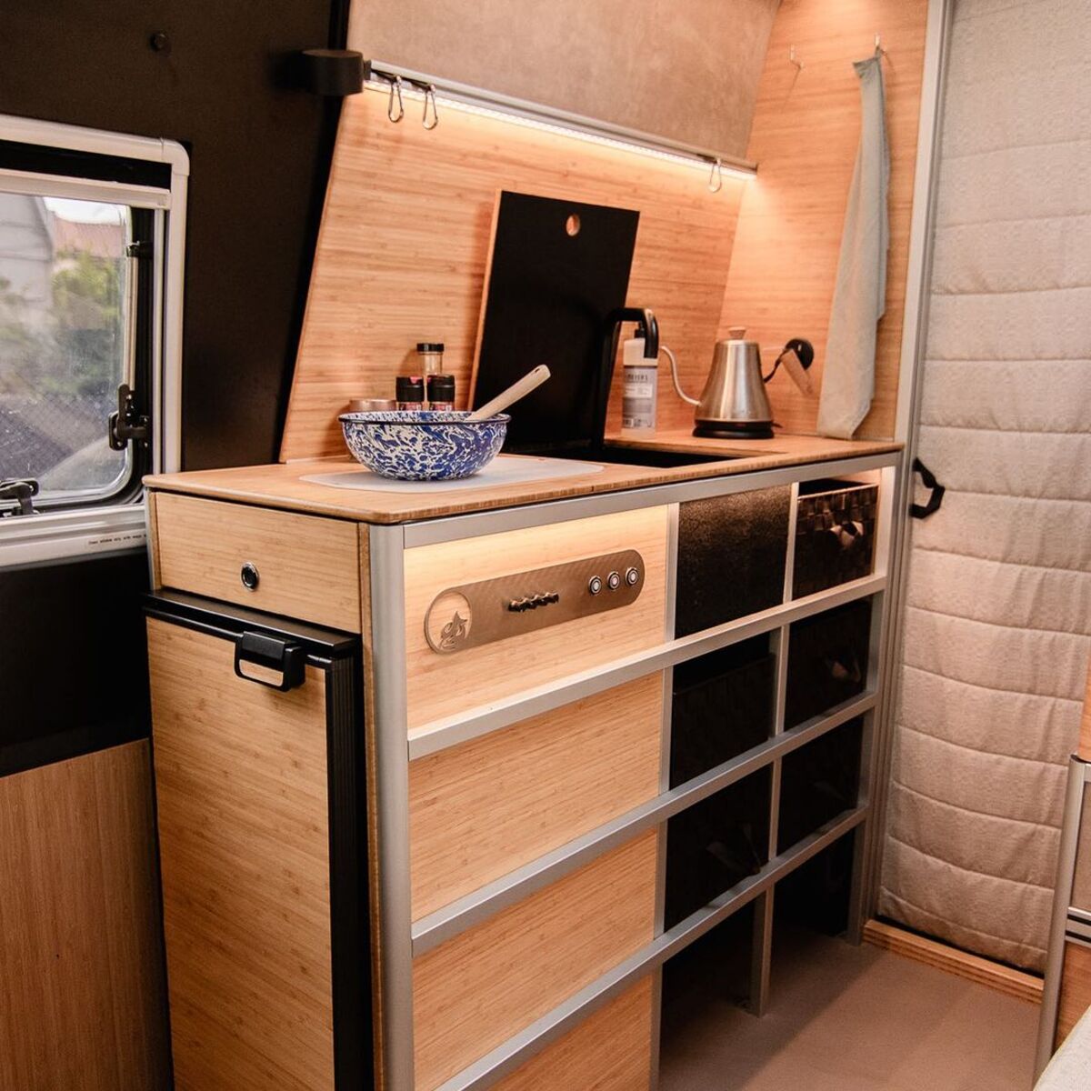 the nook van conversion offers spa bathroom and garage hidden kitchen and comfy lounge 10