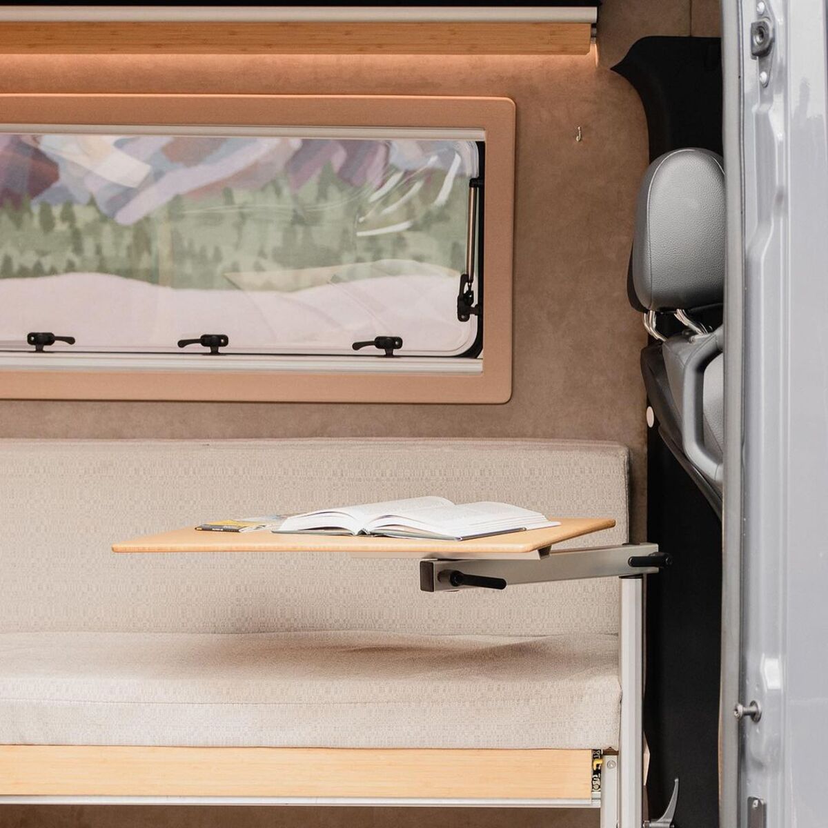 the nook van conversion offers spa bathroom and garage hidden kitchen and comfy lounge 19