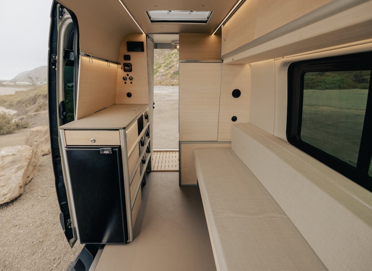 the nook van conversion offers spa bathroom and garage hidden kitchen and comfy lounge 2