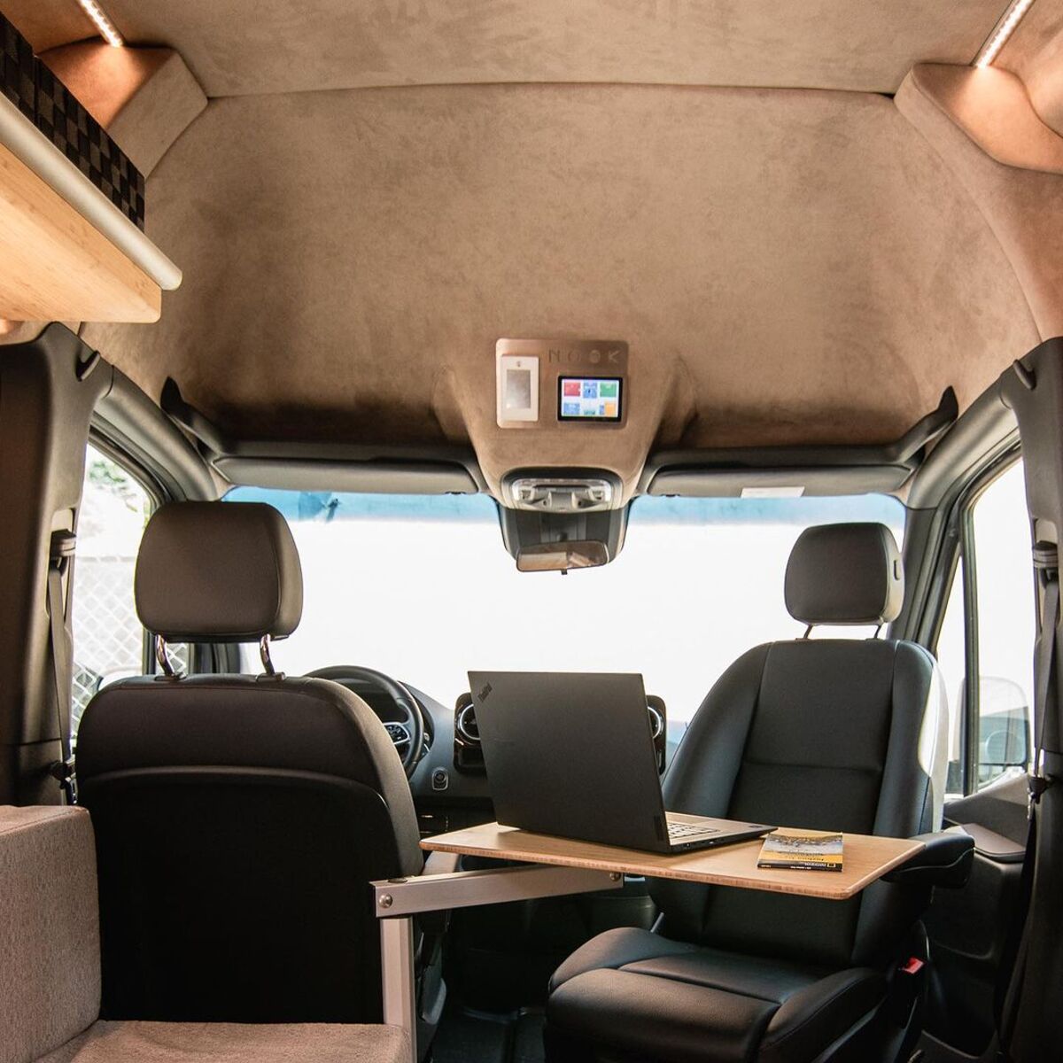 the nook van conversion offers spa bathroom and garage hidden kitchen and comfy lounge 20