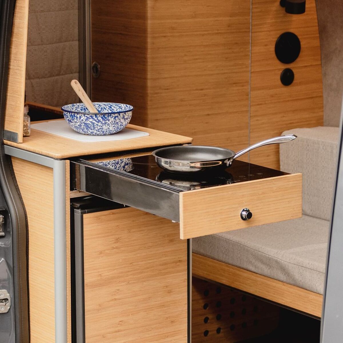 the nook van conversion offers spa bathroom and garage hidden kitchen and comfy lounge 3
