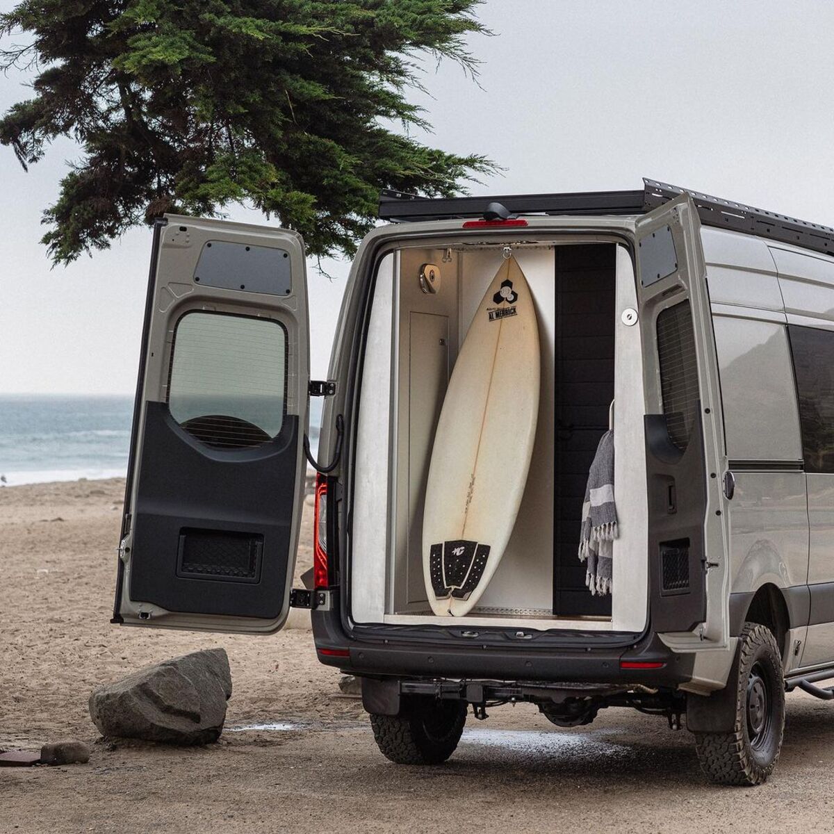 the nook van conversion offers spa bathroom and garage hidden kitchen and comfy lounge 4
