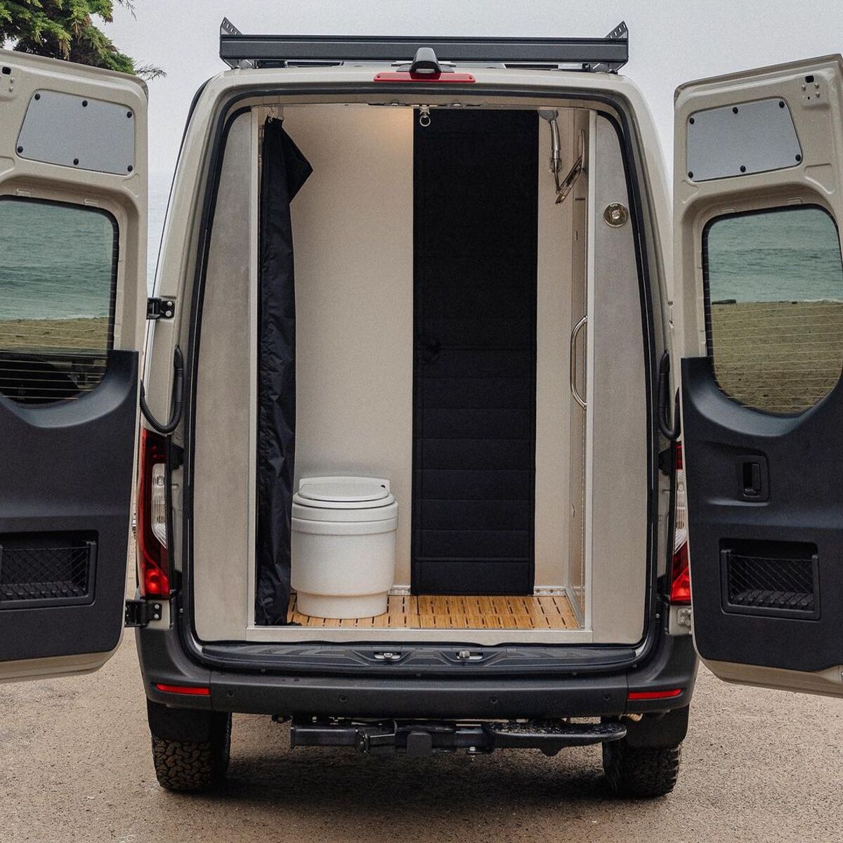 the nook van conversion offers spa bathroom and garage hidden kitchen and comfy lounge 5