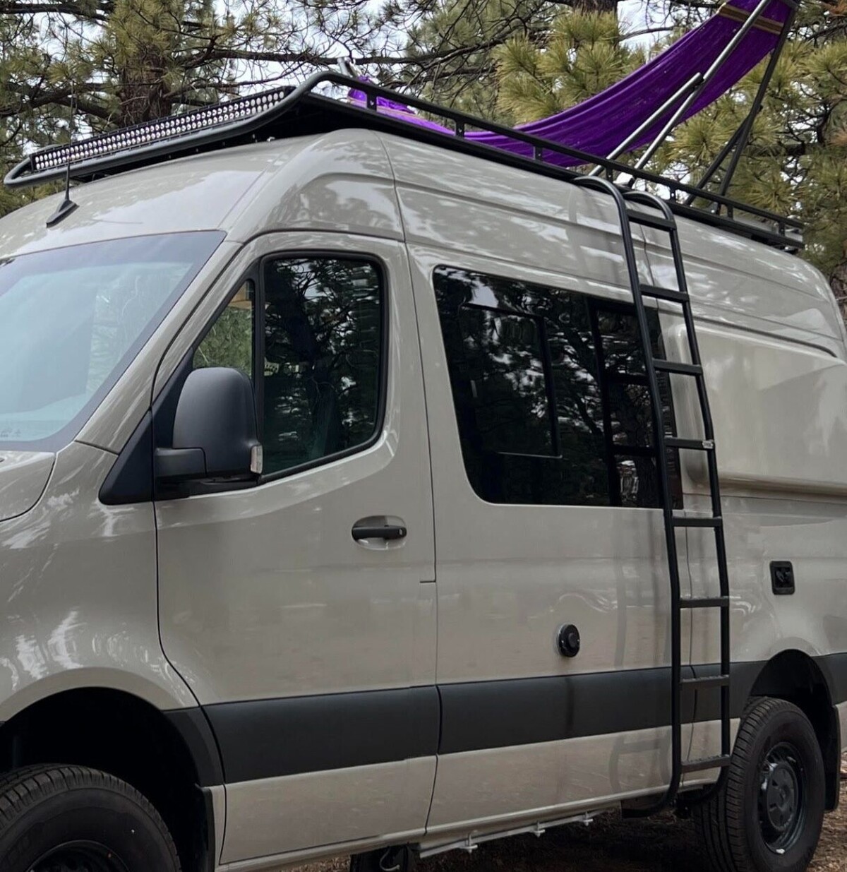 this luxurious big bear vans camper conversion has an elevator bed and rooftop decking 1