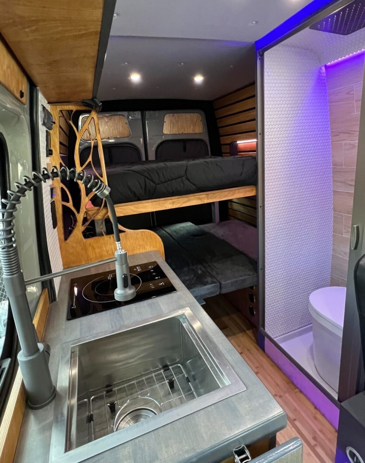 this luxurious big bear vans camper conversion has an elevator bed and rooftop decking 12
