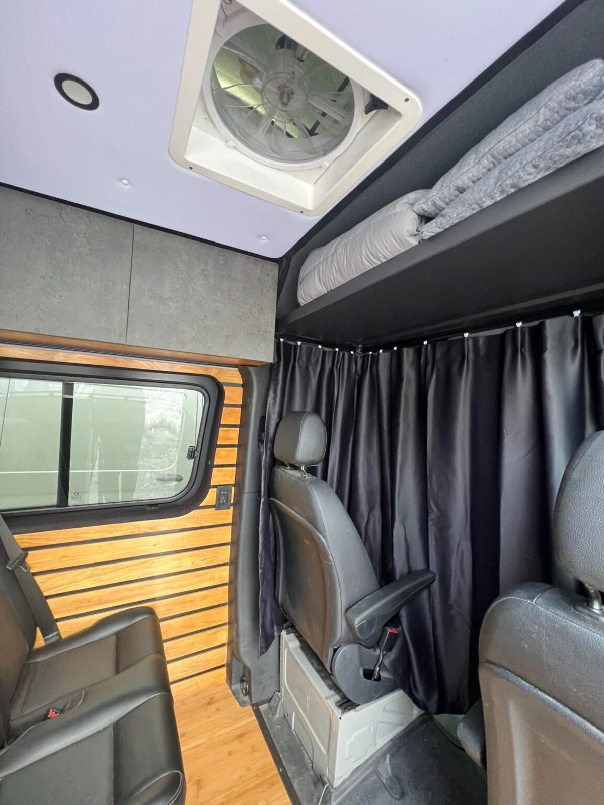this luxurious big bear vans camper conversion has an elevator bed and rooftop decking 13
