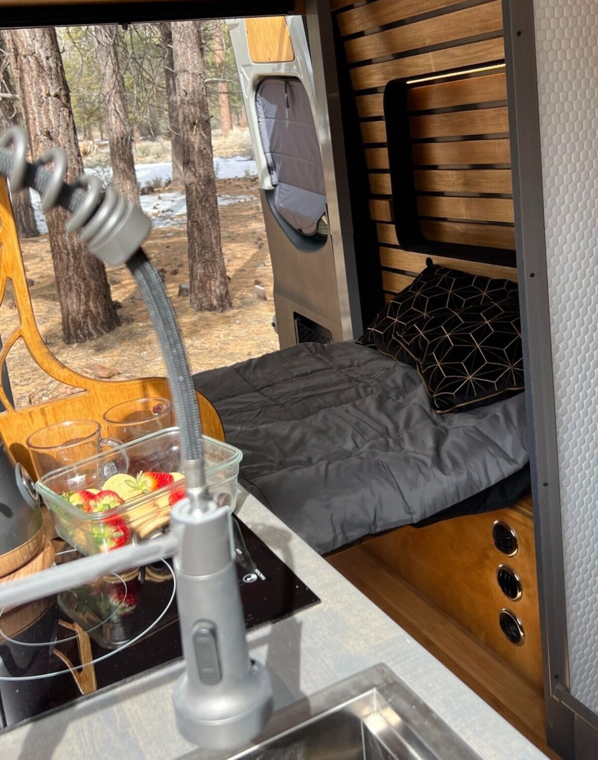 this luxurious big bear vans camper conversion has an elevator bed and rooftop decking 14
