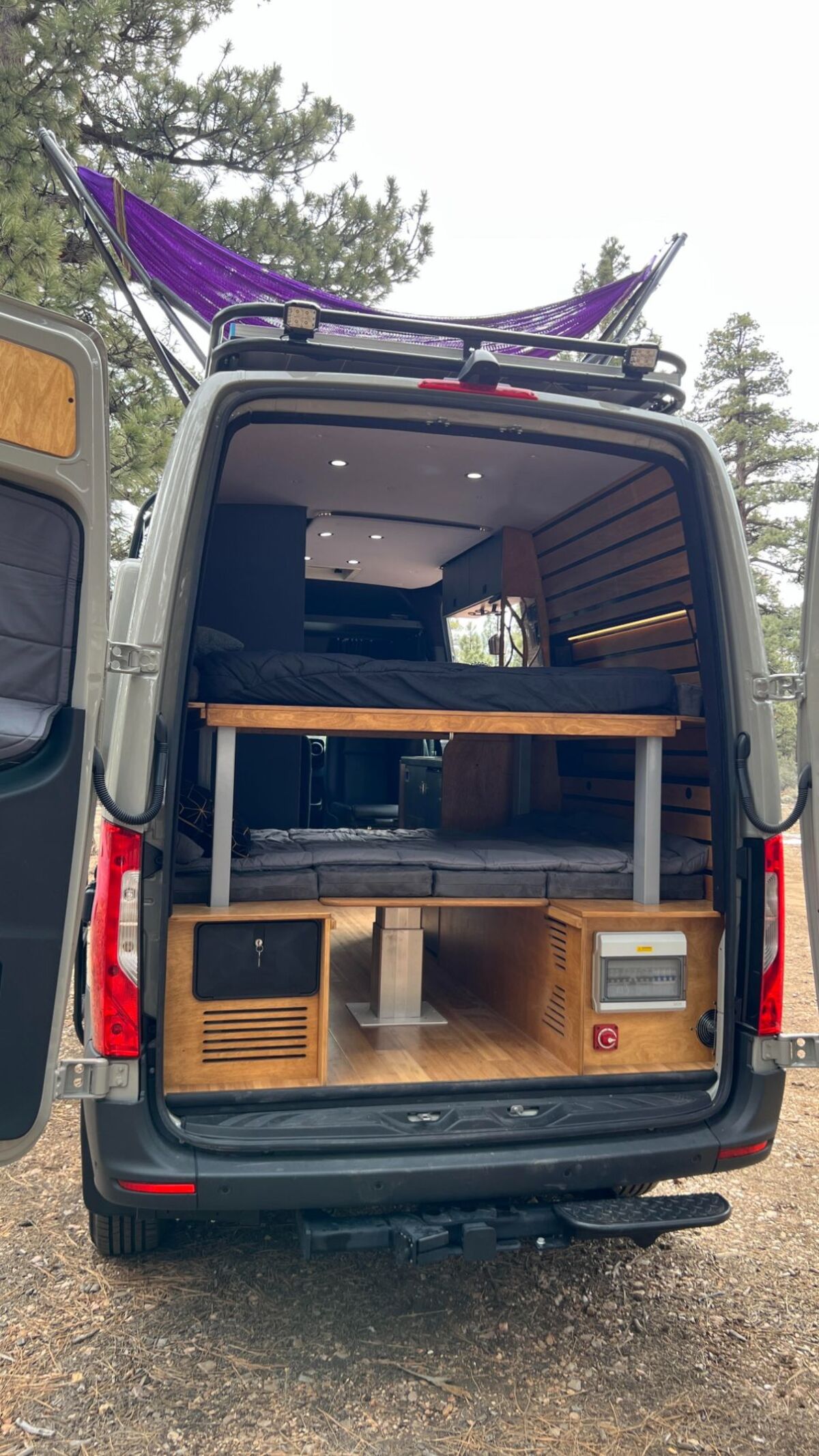 this luxurious big bear vans camper conversion has an elevator bed and rooftop decking 15