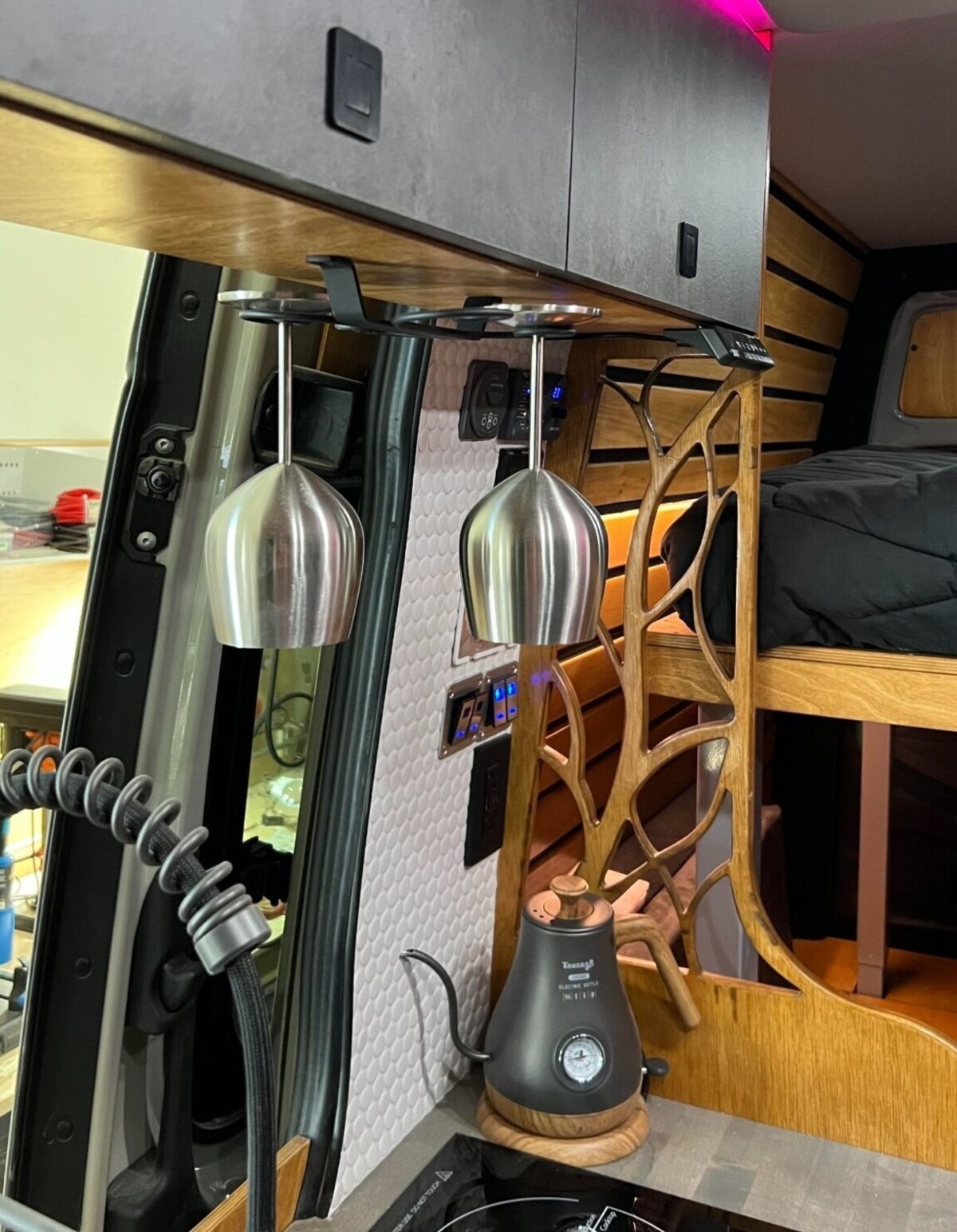 this luxurious big bear vans camper conversion has an elevator bed and rooftop decking 16