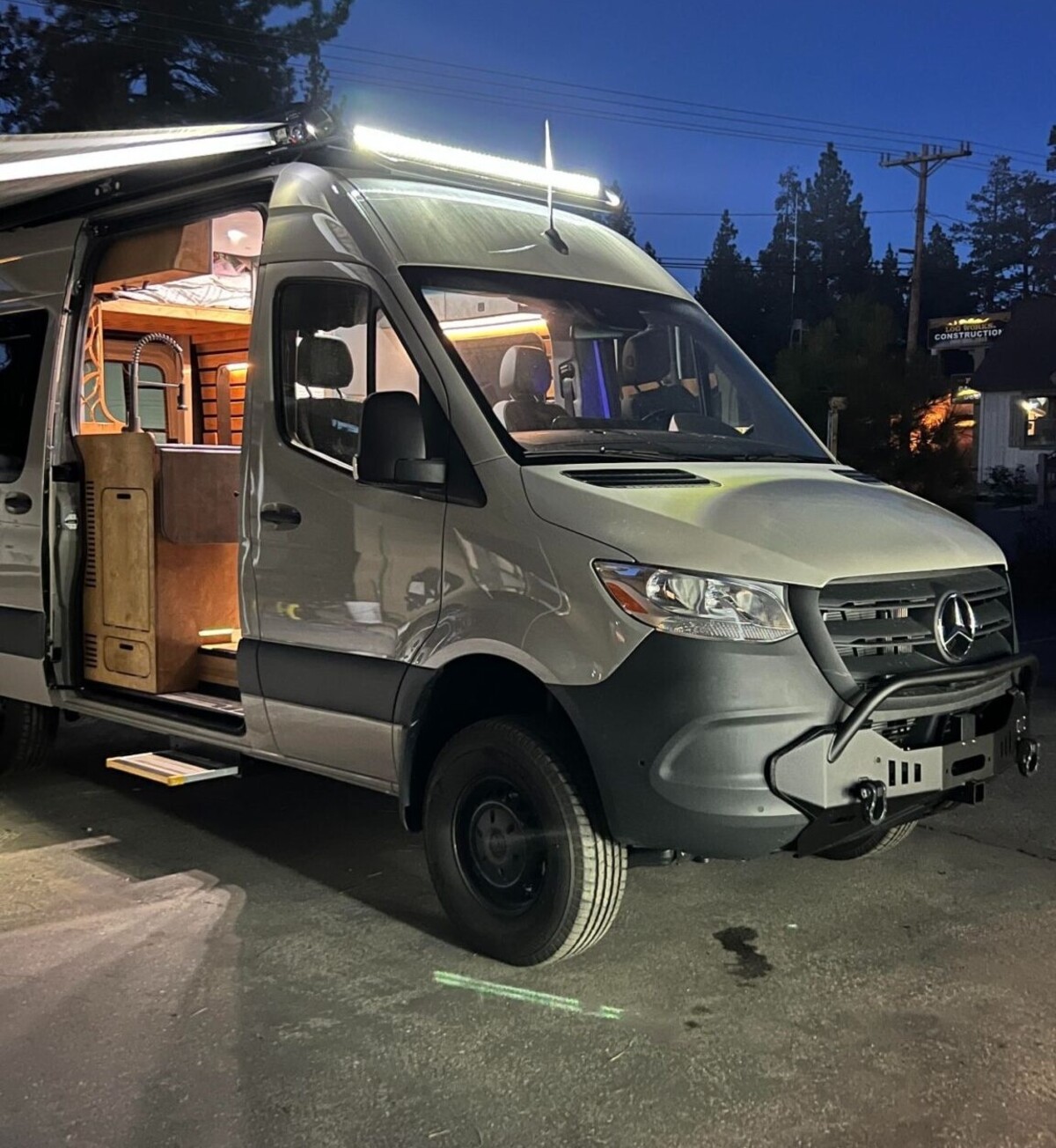 this luxurious big bear vans camper conversion has an elevator bed and rooftop decking 19