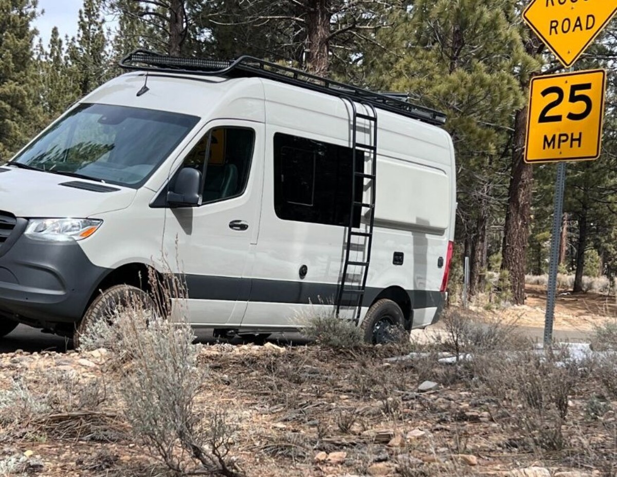 this luxurious big bear vans camper conversion has an elevator bed and rooftop decking 2