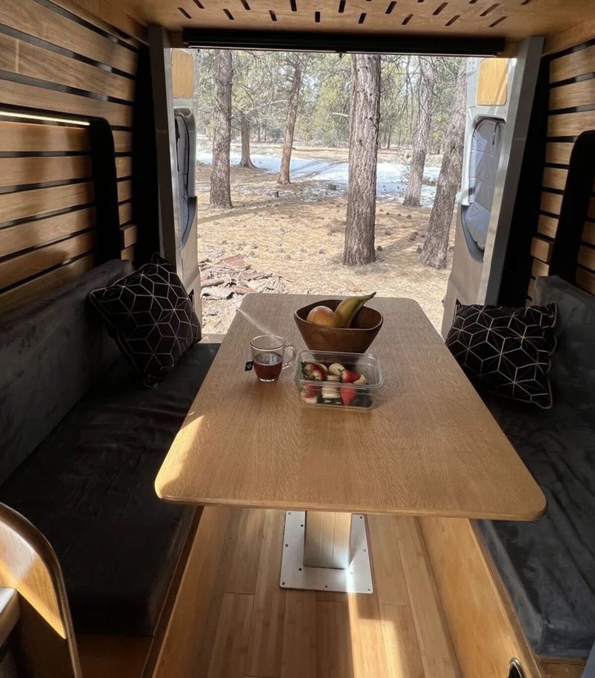 this luxurious big bear vans camper conversion has an elevator bed and rooftop decking 4