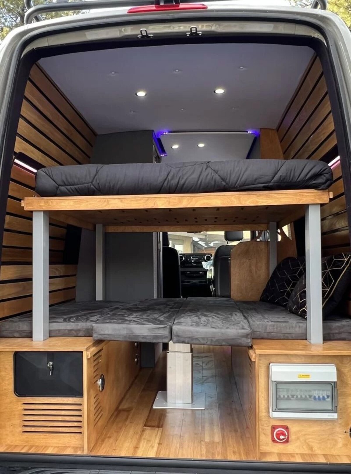 this luxurious big bear vans camper conversion has an elevator bed and rooftop decking 5