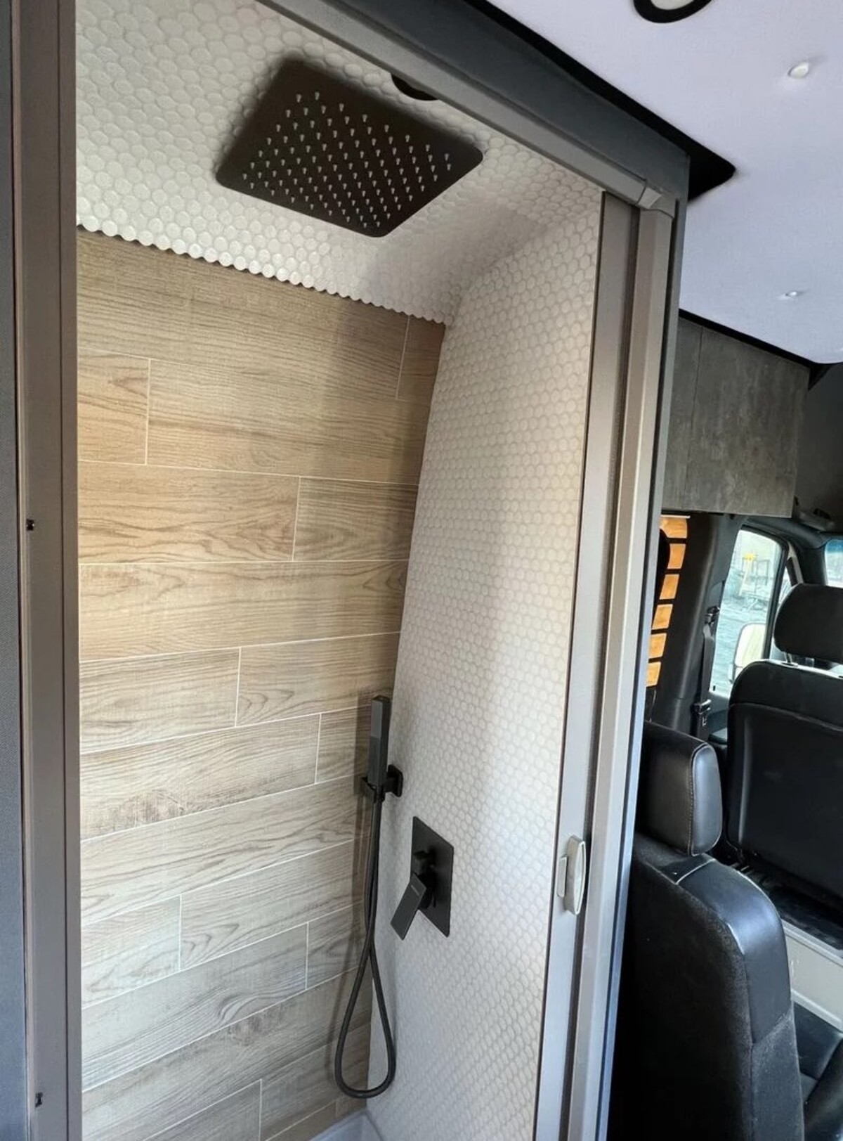 this luxurious big bear vans camper conversion has an elevator bed and rooftop decking 7