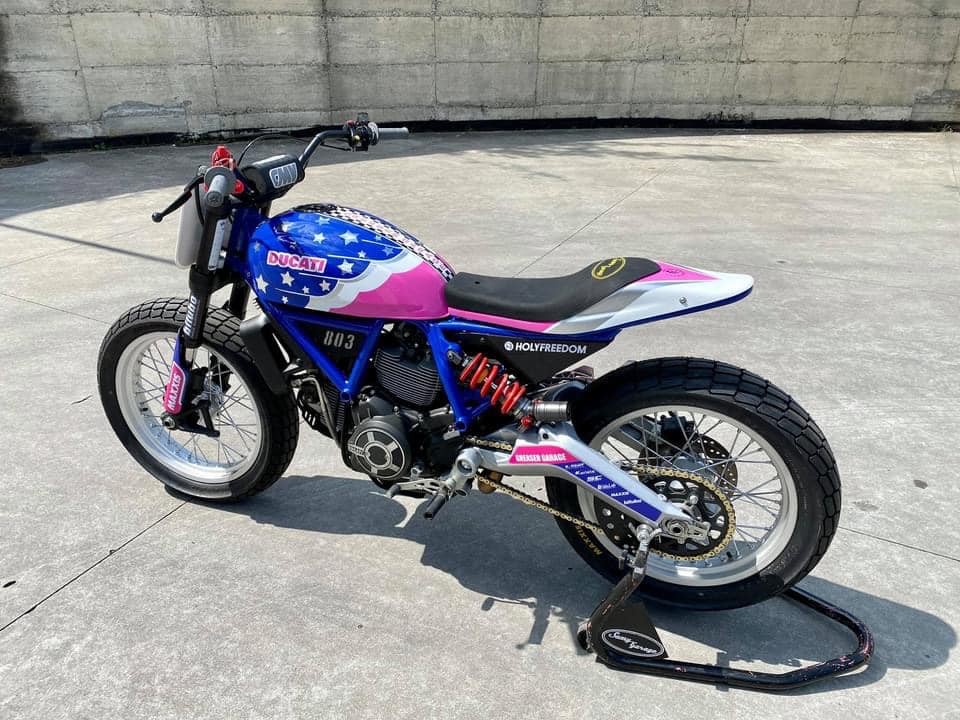 this modified ducati scrambler is a race ready flat tracker dressed in playful livery 1