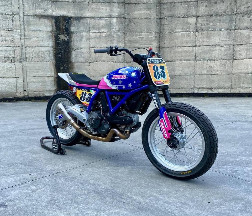 this modified ducati scrambler is a race ready flat tracker dressed in playful livery 13