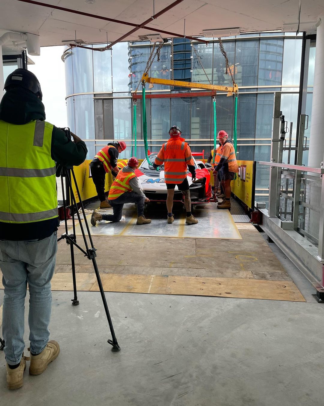 this is how the mclaren lifted by crane to a 57 floor penthouse looks in the living room 2