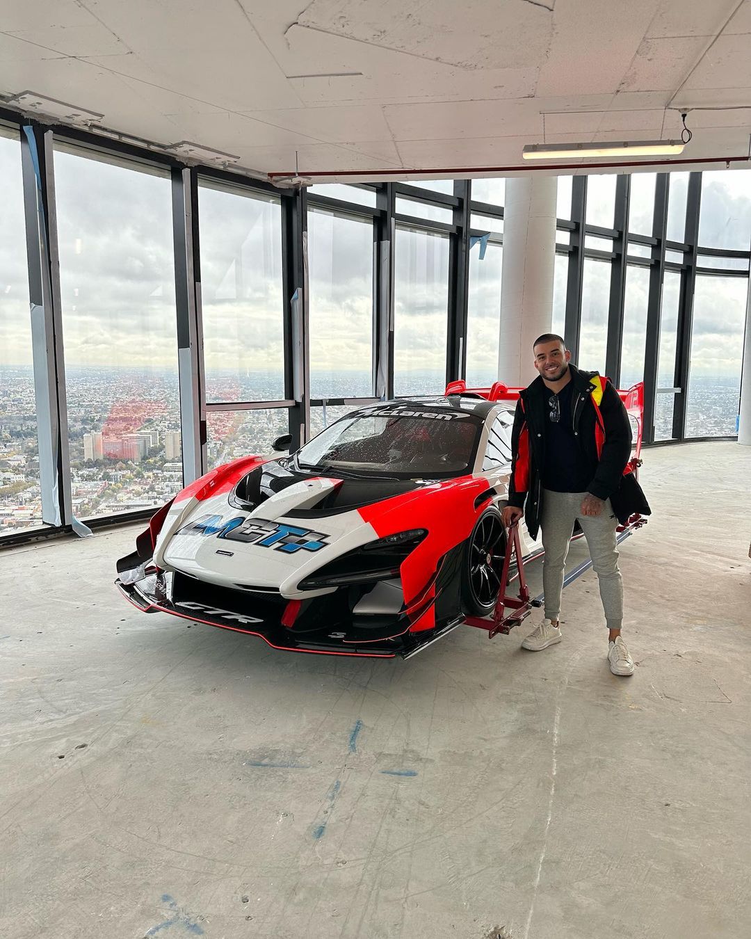 this is how the mclaren lifted by crane to a 57 floor penthouse looks in the living room 3